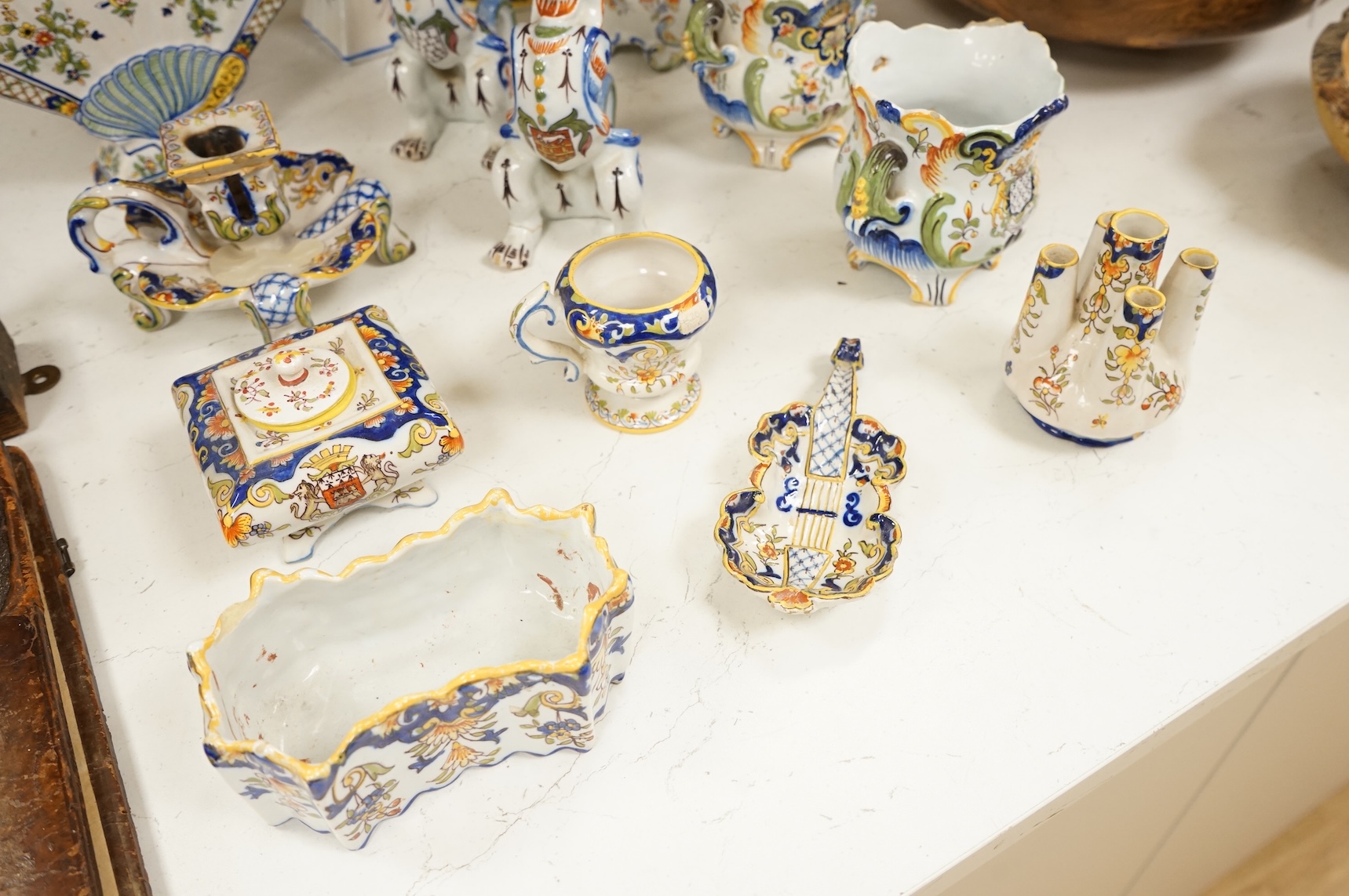 A collection of early 20th century French faience pieces, tallest 37cm